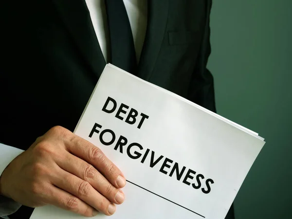Debt forgiveness agreement that the businessman holds. — Stock Photo, Image