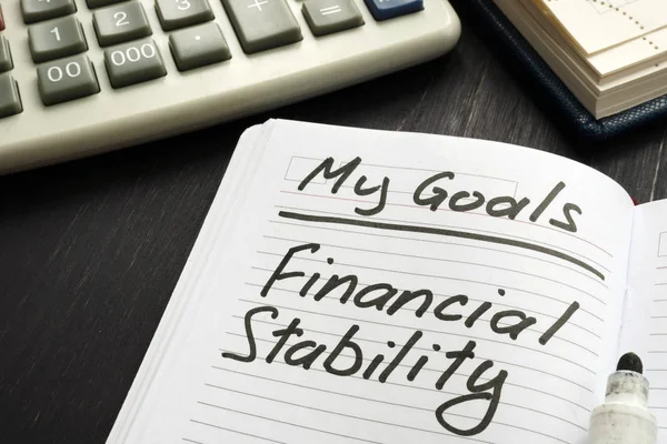 Personal goal - financial stability inscription on the sheet.