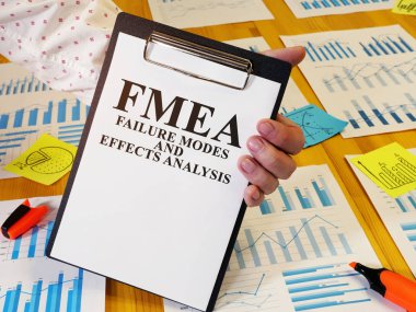 FMEA Failure Modes and Effects Analysis report in the clipboard. clipart