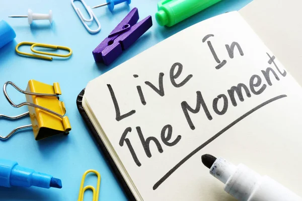 Live in the Moment handwritten phrase in the note. — Stock Photo, Image