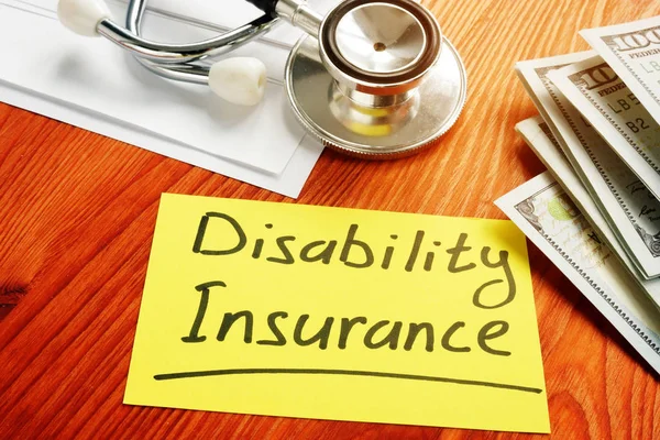 Disability Insurance memo sign with money. — Stock Photo, Image