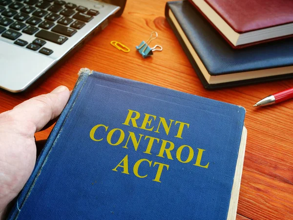 Man in holding Rent Control Act law. — 스톡 사진
