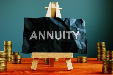 Annuity sign on the black sheet ans coins. clipart