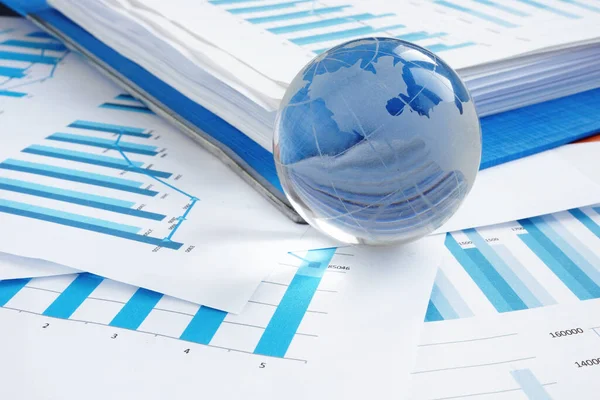 Global Business Concept Glass Globe Financial Charts — Stock Photo, Image