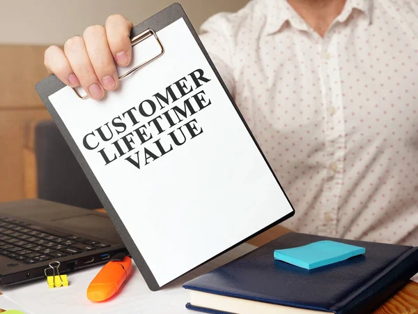 Man Holding Customer Lifetime Value Report — Stock Photo, Image