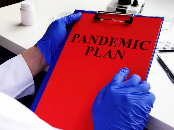 Doctor Reading Pandemic Plan Preparedness — Stock Photo, Image