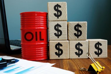 Düşen petrol fiyatları. Fıçı ve dolar işaretleri.