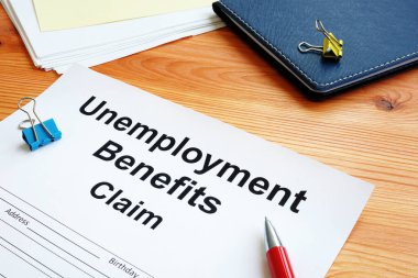 Unemployment benefits claim and stack of documents. clipart