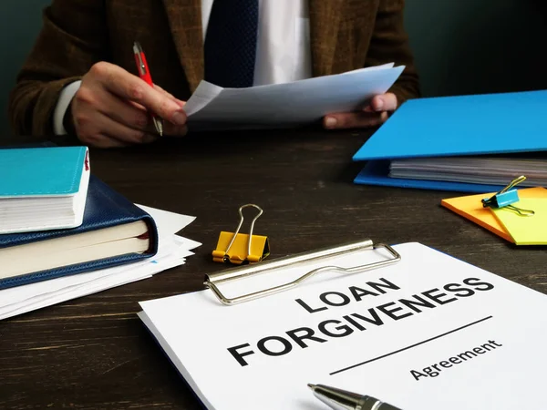 Loan Forgiveness Form Man Checks Documents — Stock Photo, Image