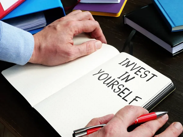Man Writes Invest Yourself Inspirational Phrase Change Life — Stock Photo, Image