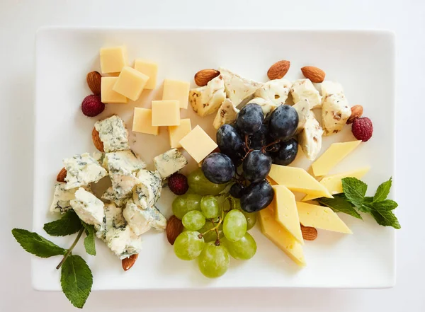 Cheese variation on a white table. — Stock Photo, Image