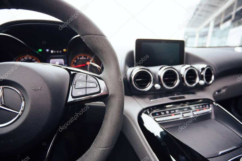 Control buttons on steering wheel. Car interior.