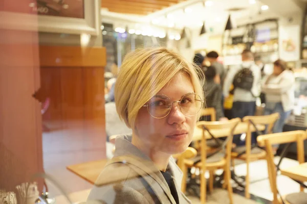 Closeup portrait of an elegant middle aged woman wearing glasses — Stock Photo, Image