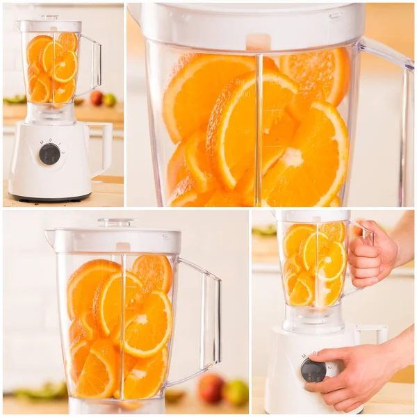 Weißer Mixer mit saftigen Orangen auf einem Holztisch — Stockfoto