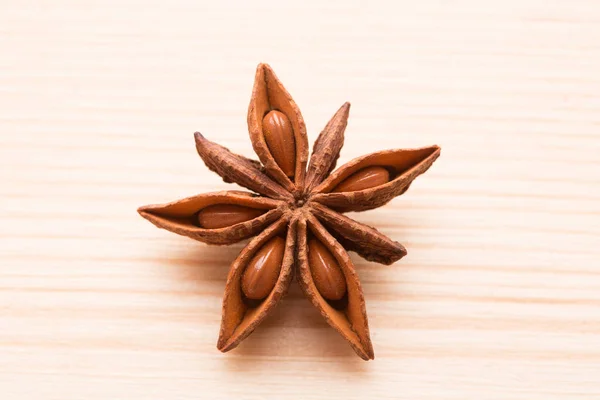 Organic star anise on a wooden table — Stock Photo, Image