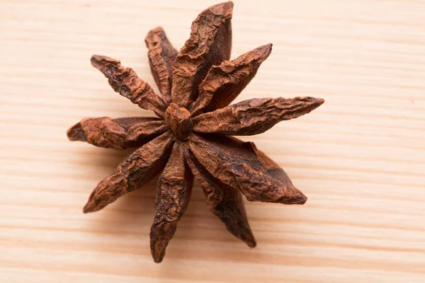 Organic star anise on a wooden table — Stock Photo, Image