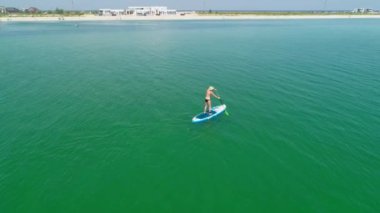 Attractive Woman on Stand Up Paddle Board, SUP, Tropical Ocean