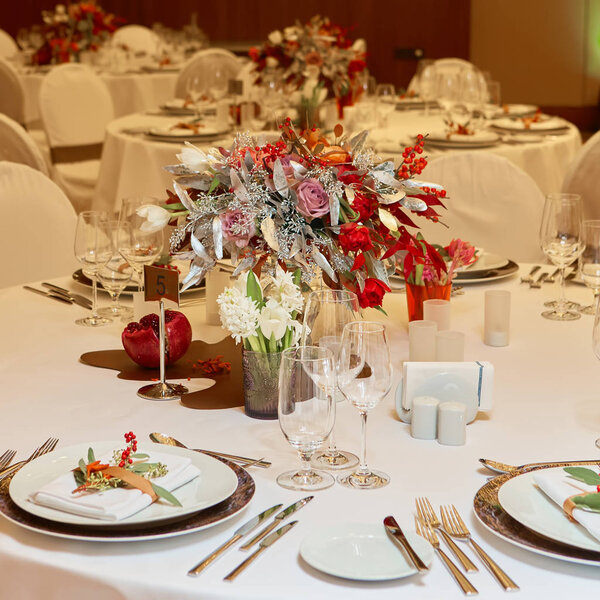 catering table set service with silverware, napkin and glass at restaurant before party