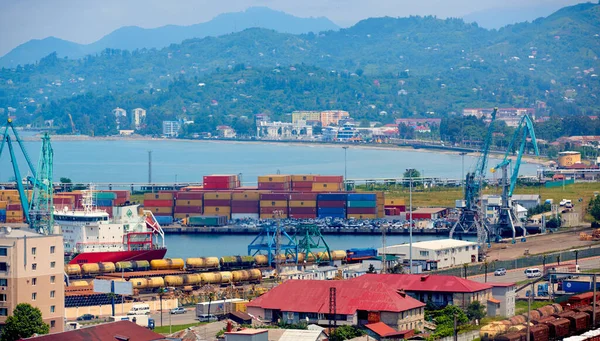 Batumi, Georgia - June 09, 2015: Batumi International Container Terminal. Cargo port in Batumi, Georgia. Cargo port with blue sea and blue sky, ships, trains cranes, containers — Stock Photo, Image