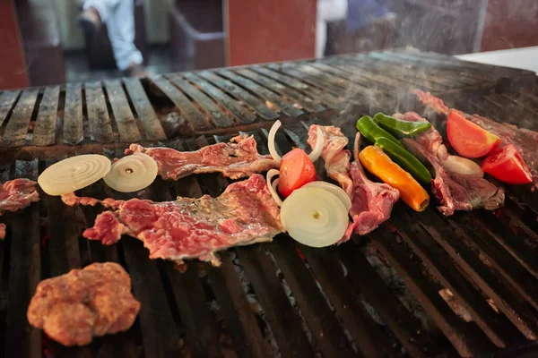 Fresh meat and vegetables preparing on grill. — Stock Photo, Image