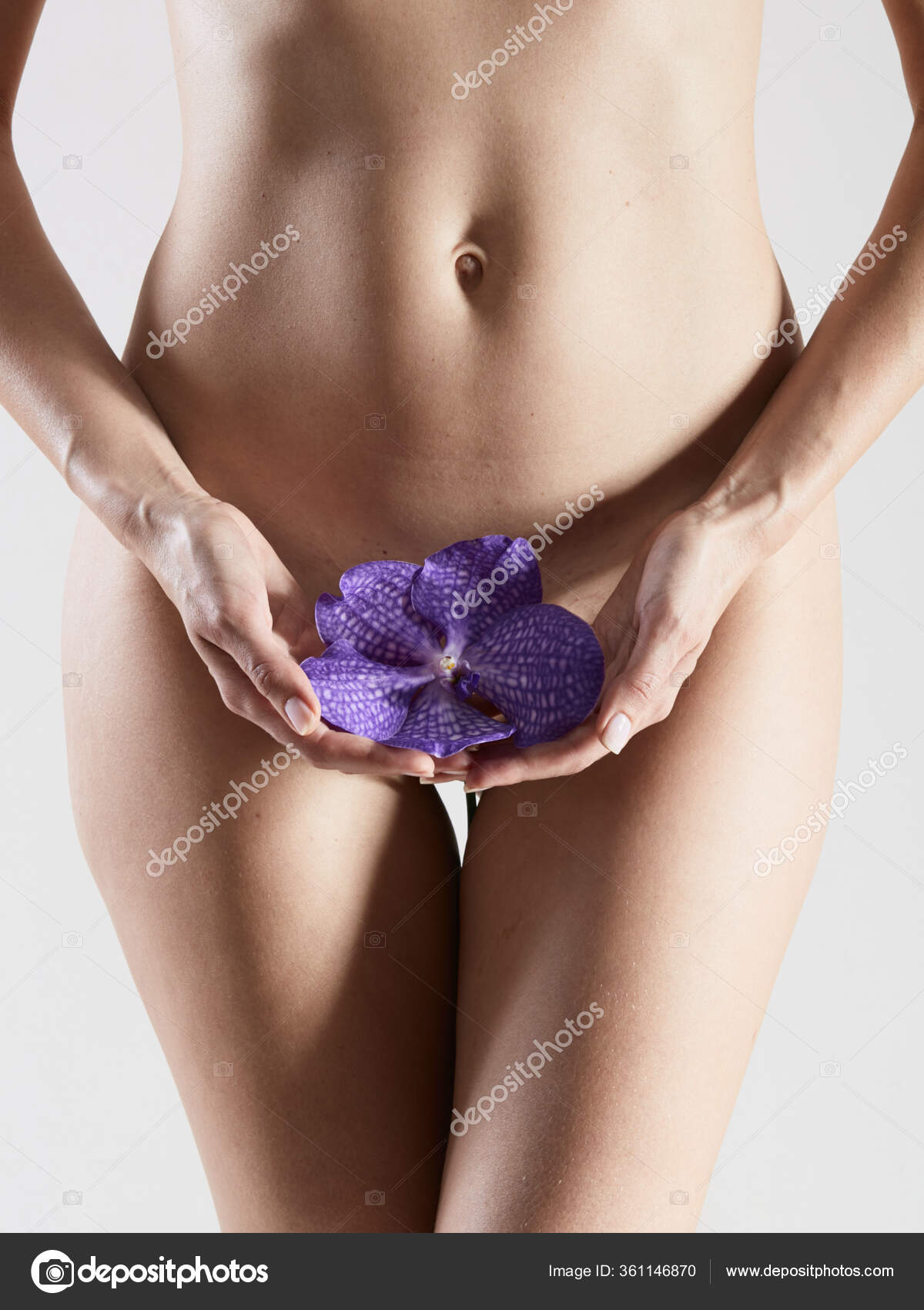 Beautiful nude fit woman body with blue flower. No retouch. Stock Photo by  ©sarymsakov 361146870