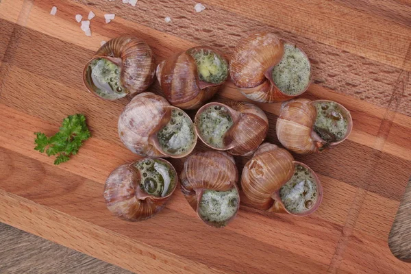 Snails with garlic, butter as french gastronomy gourmet food. — Stock Photo, Image