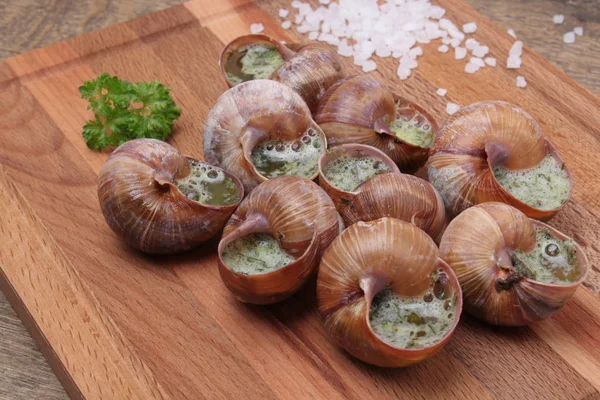 Snails with garlic, butter as french gastronomy gourmet food. — Stock Photo, Image