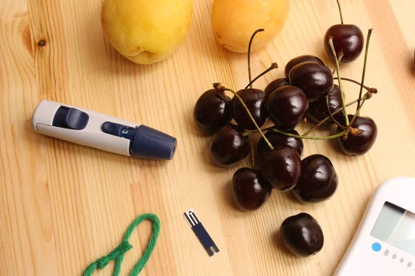 Glucometer cherry apricot — Stock Photo, Image