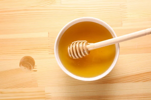 Honey on a wooden background — Stock Photo, Image