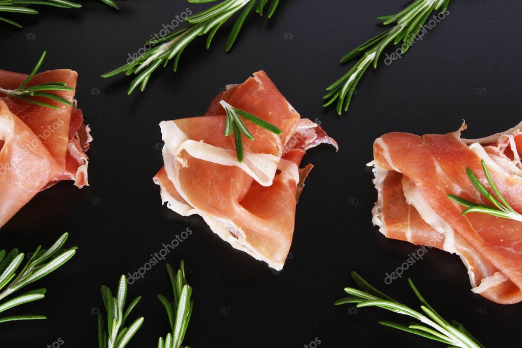 Prosciutto on a dark background — Stock Photo © SergeyLapin #166195438