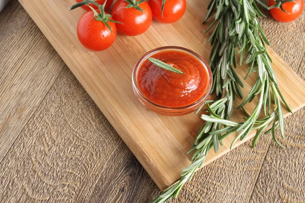 Tomato sauce ketchup tomatoes rosemary — Stock Photo, Image