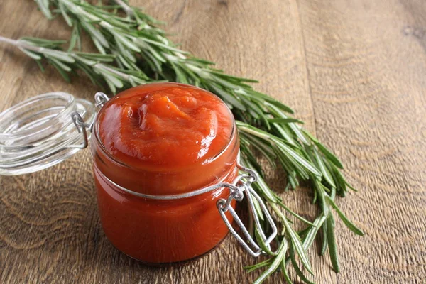 Tomato sauce ketchup tomatoes rosemary — Stock Photo, Image