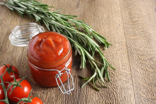 Tomato sauce ketchup tomatoes rosemary — Stock Photo, Image