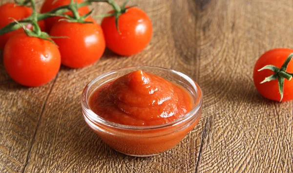 Tomato sauce ketchup tomatoes rosemary — Stock Photo, Image