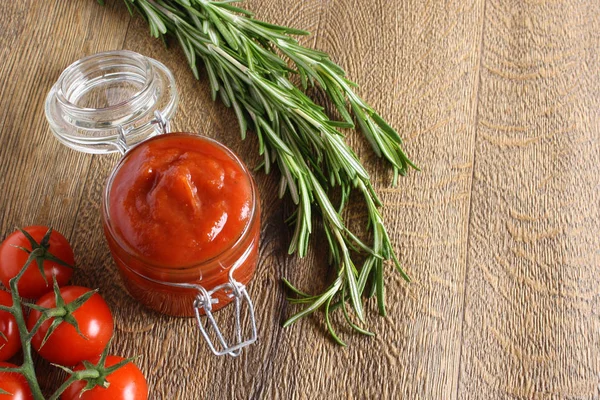 Tomato sauce ketchup tomatoes rosemary — Stock Photo, Image