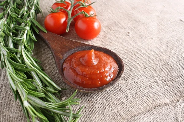 Tomato sauce ketchup tomatoes rosemary — Stock Photo, Image