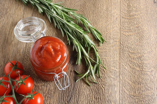 Tomato sauce ketchup tomatoes rosemary — Stock Photo, Image