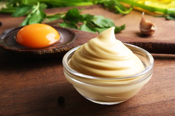 Mayonnaise sauce on a wooden background cooking — Stock Photo, Image