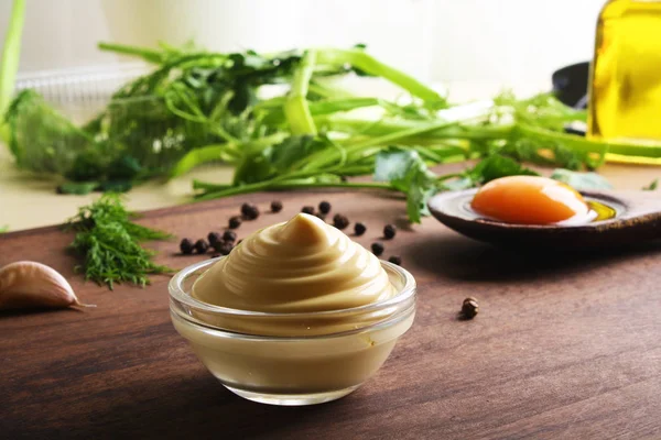 Mayonnaise sauce on a wooden background cooking — Stock Photo, Image