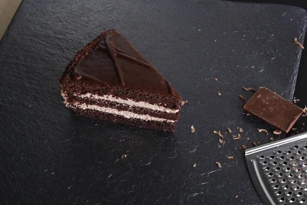cake prague chocolate dessert on stone background black