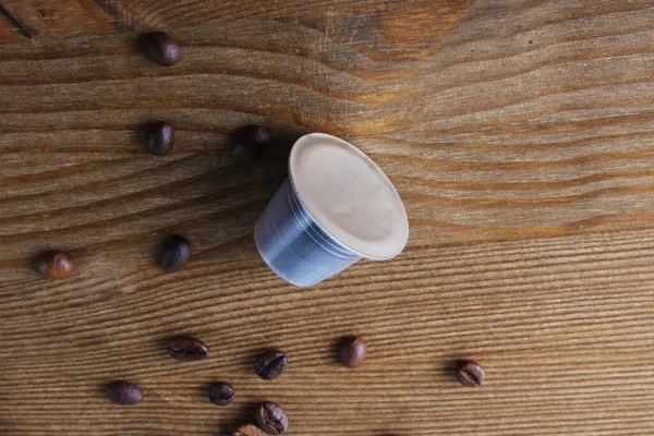 Kaffeekapseln Auf Einem Holzgrund — Stockfoto