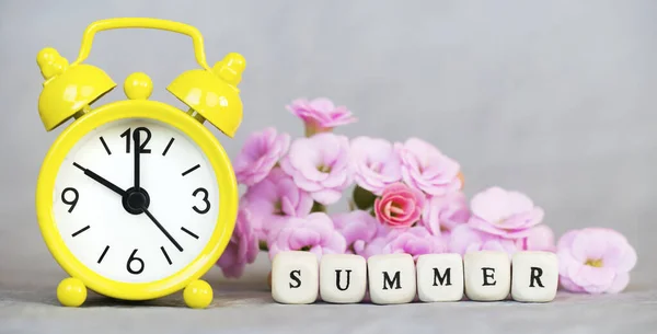 Yellow Alarm Clock Pink Flowers Gray Background Summer Time Nature — Stock Photo, Image