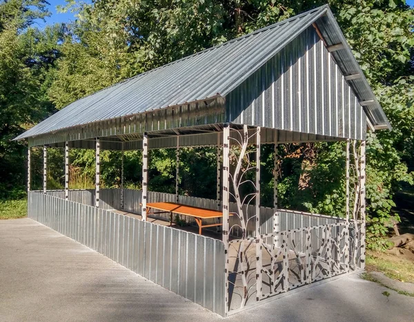 Large metal pavilion in the forest — Stock Photo, Image