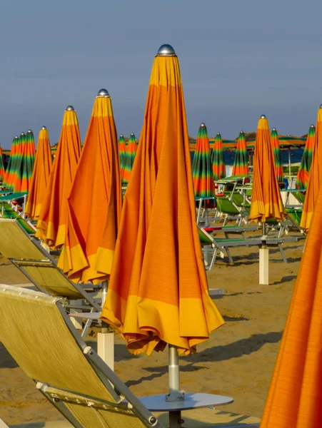 Rimini - Orange closed umbrellas — Stock Photo, Image