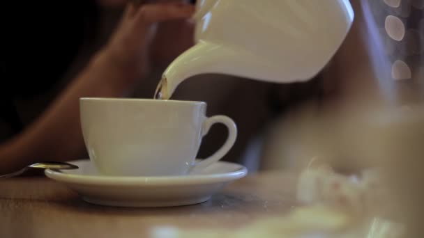 Woman Pours Hot Water Kettle Cup — Stock Video