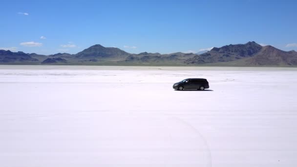 Drone Follows Modern Minivan Car Moving Atmospheric Landscape Flat Salt — ストック動画