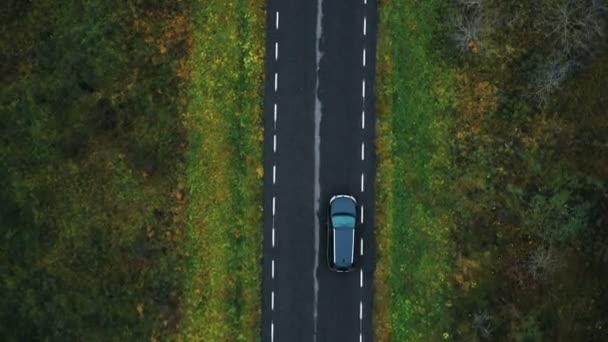 Drone Top View Camera Tracking Black Car Driving Empty Highway — Stockvideo