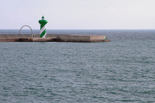 Beacon on pier — Stock Photo, Image