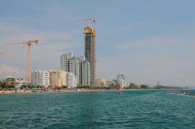 Sea coast and modern construction. Limassol, Cyprus clipart