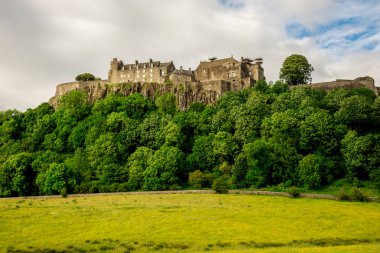 A view of Stirling Castle on top of the rocky hill in central Scotland clipart